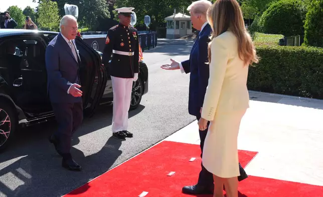 President Donald Trump and first lady Melania Trump greet Britain's King Charles III and Queen Camilla as they arrive at the White House, Monday, April 27, 2026, in Washington (AP Photo/Mark Schiefelbein)