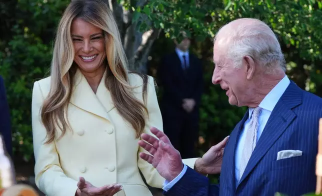First lady Melania Trump and Britain's King Charles III talk during a tour of the White House garden and bee hive on the South Lawn of the White House, Monday, April 27, 2026, in Washington. (AP Photo/Alex Brandon, Pool)