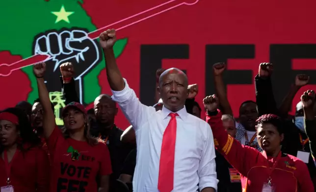 FILE - Economic Freedom Fighters party leader Julius Malema raises his fist at an election rally in Polokwane, South Africa, on May 25, 2024. (AP Photo/Themba Hadebe, File)