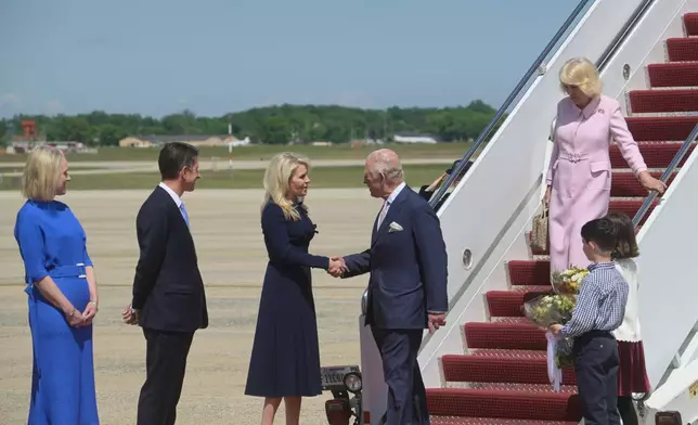 King Charles III shakes hands with U.S. Chief of Protocol Monica Crowley as Queen Camilla deplanes and British Ambassador to the United States Christian Turner, second from left, looks on, at Joint Base Andrews, Md., Monday, April 27, 2026. They are in the U.S. for a four-day state visit aimed at celebrating the United States' 250th anniversary, including a White House state dinner and a speech to Congress. (AP Photo/Rod Lamkey, Jr.)