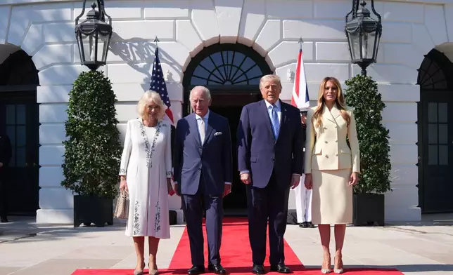 President Donald Trump and first lady Melania Trump greet Britain's King Charles III and Queen Camilla as they arrive at the White House, Monday, April 27, 2026, in Washington. (AP Photo/Alex Brandon)