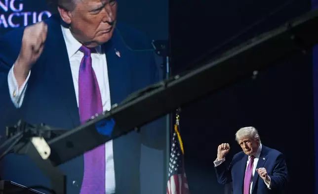 President Donald Trump dances at a Turning Point USA event at Dream City Church, Friday, April 17, 2026, in Phoenix. (AP Photo/Alex Brandon)