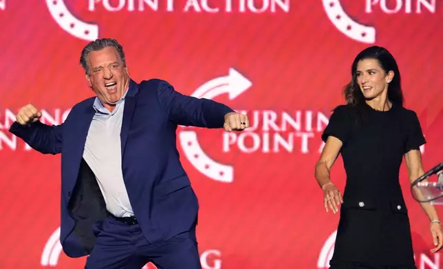 Jeremy Roenick, a former professional hockey player, and Danica Patrick, a former professional race car driver, participate in a Turning Point USA event Friday, April 17, 2026, in Phoenix. (AP Photo/Ross D. Franklin)