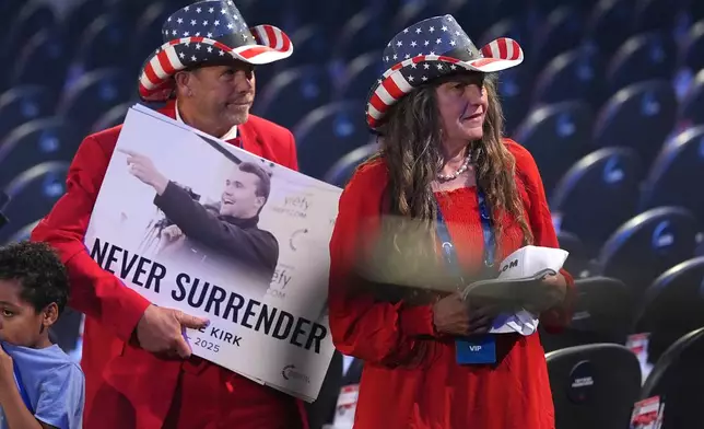 People prepare to depart after President Donald Trump spoke at a Turning Point USA event at Dream City Church, Friday, April 17, 2026, in Phoenix. (AP Photo/Ross D. Franklin)