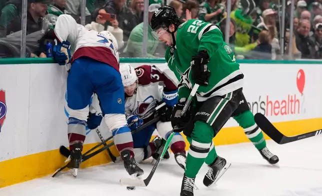 Dallas Stars center Mavrik Bourque (22) takes control of the puck in the first period of an NHL hockey game against the Colorado Avalanche Saturday, April 4, 2026, in Dallas. (AP Photo/Tony Gutierrez)