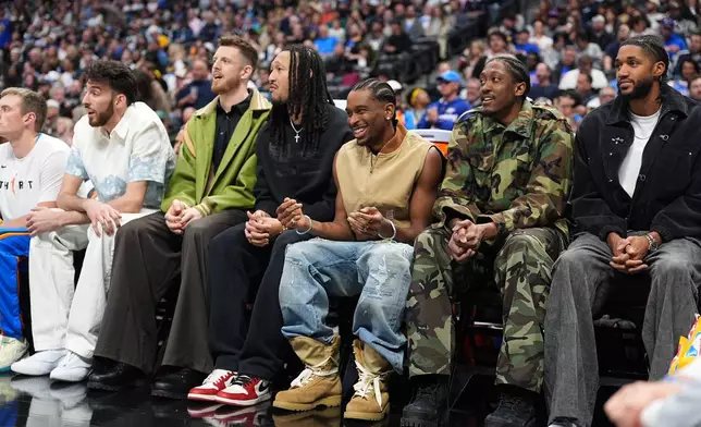 From left, Oklahoma City Thunder players Chet Holmgren, Isaiah Hartenstein, Oklahoma City Thunder forward Jaylin Williams, Shai Gilgeous-Alexander, Jalen Williams and Isaiah Joe look on from the bench in the first half of an NBA basketball game against the Denver Nuggets Friday, April 10, 2026, in Denver. (AP Photo/David Zalubowski)