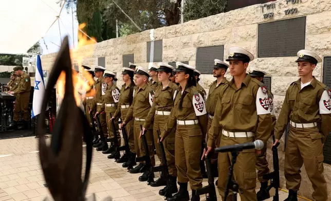 Soldiers attend a ceremony commemorating Israel's Remembrance Day for fallen soldiers, or Yom HaZikaron, at the Military Cemetery on Mount Herzl in Jerusalem, Tuesday, April 21, 2026. (Ilia Yefimovich/Pool Photo via AP)