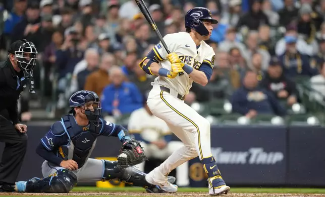 Milwaukee Brewers' Christian Yelich hits a two-run RBI single during the eighth inning of a baseball game against the Tampa Bay Rays, Wednesday, April 1, 2026, in Milwaukee. (AP Photo/Kayla Wolf)