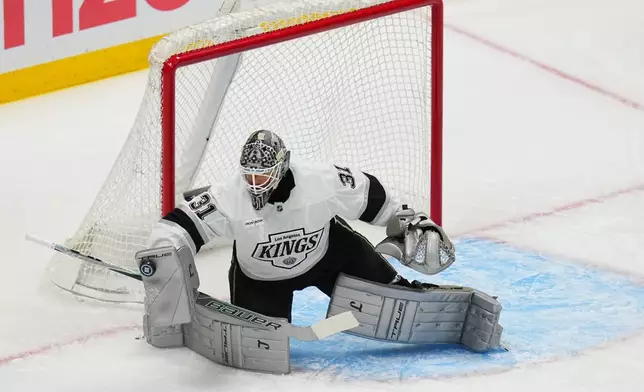 Los Angeles Kings goaltender Anton Forsberg makes a save against the Colorado Avalanche during the first period of Game 1 in the first round of the NHL hockey Stanley Cup playoffs, Sunday, April 19, 2026, in Denver. (AP Photo Jack Dempsey)