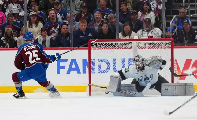 Colorado Avalanche right wing Logan O'Connor (25) scores against Los Angeles Kings goaltender Anton Forsberg (31) during the third period of Game 1 in the first round of the NHL hockey Stanley Cup playoffs, Sunday, April 19, 2026, in Denver. (AP Photo Jack Dempsey)
