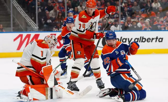 Anaheim Ducks goaltender Lukas Dostal (1) makes a save against Edmonton Oilers' Vasily Podkolzin (92) during second period NHL playoff action in Edmonton on Wednesday, April 22, 2026. (Codie McLachlan/The Canadian Press via AP)