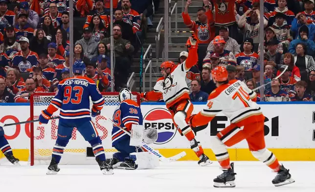 Anaheim Ducks' Ryan Poehling (25) celebrates a goal against Edmonton Oilers goaltender Connor Ingram (39) during second period NHL playoff action in Edmonton on Wednesday, April 22, 2026. (Codie McLachlan/The Canadian Press via AP)