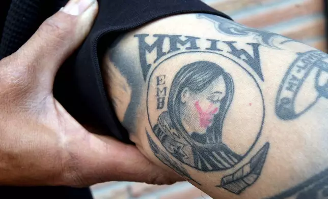 Gerald Begay, whose mother Ella Mae Begay went missing from her home, shows his Missing and Murdered Indigenous Women tattoo at his home in Denver, April 2, 2026. (AP Photo/Thomas Peipert)