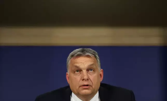 FILE -Hungarian Prime Minister Viktor Orban talks to journalists during a news conference following an European People's Party meeting at the European Parliament in Brussels, March 20, 2019. (AP Photo/Francisco Seco, File)