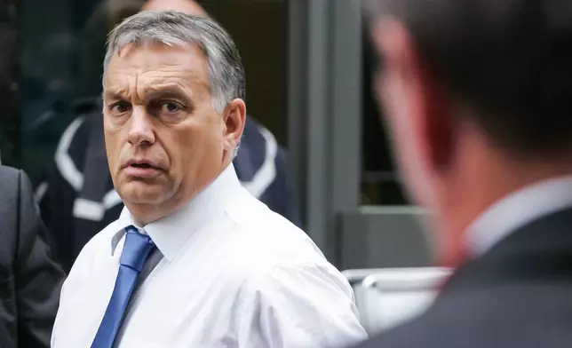 FILE -Hungarian Prime Minister Viktor Orban, right, arrives for a European Peoples Party, EPP meeting, ahead of an emergency EU heads of state summit on migration, in Brussels on Sept. 23, 2015. (AP Photo/Francois Walschaerts, File)