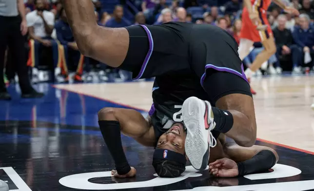Utah Jazz forward Blake Hinson (2) flips after shooting against New Orleans Pelicans guard Trey Alexander during the first half of an NBA basketball game in New Orleans, Tuesday, April 7, 2026. (AP Photo/Matthew Hinton)