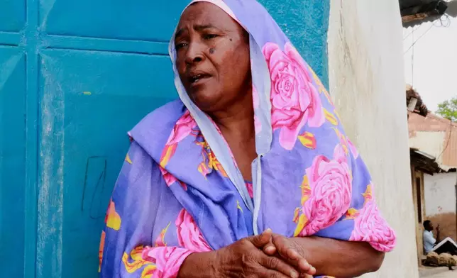Mejumaa Hassan Nyanje, a mother of four born in Owino Uhuru village, sits outside her home in Mikindani, Mombasa County, Kenya, on April 10, 2026. (AP Photo/Kelvin Rading)