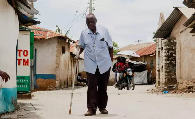 Alfred Ogulo Mulo, a village elder, walks along a street in Mikindani, Mombasa County, Kenya, on April 10, 2026. (AP Photo/Kelvin Rading)