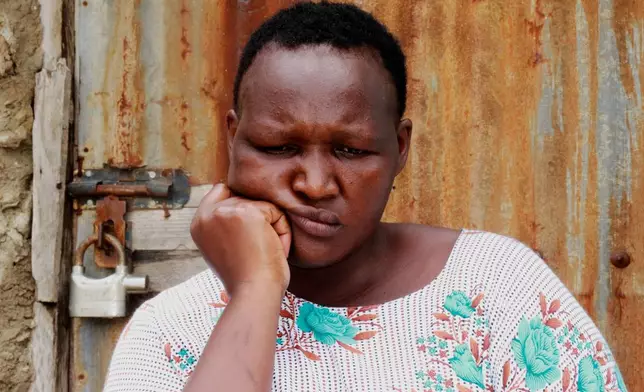 A woman sits outside her house in Owino Uhuru village in Mikindani, Mombasa County, Kenya, on April 10, 2026. (AP Photo/Kelvin Rading)