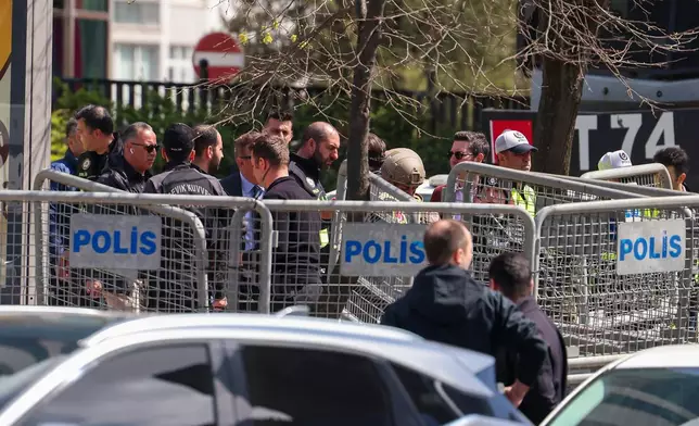 Turkish police secure the area after a gunmen attack at a building housing the Israeli Consulate in Istanbul, Turkey, Tuesday, April 7, 2026. (Omer Hamza Yildiz/DIA Photo via AP)