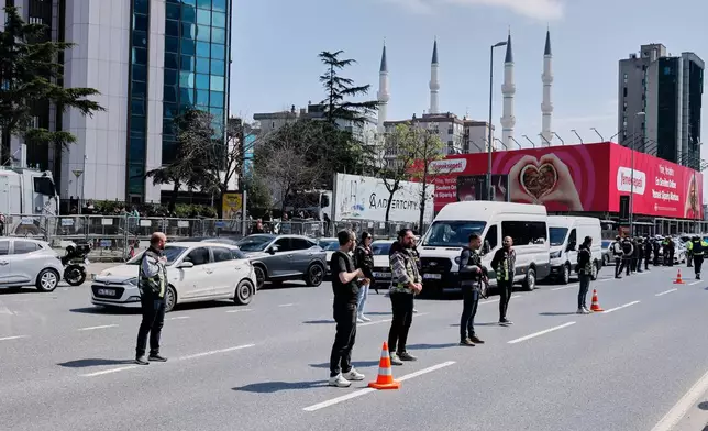 Turkish police secure the area after a gunmen attack at a building housing the Israeli Consulate in Istanbul, Turkey, Tuesday, April 7, 2026. (Omer Hamza Yildiz/DIA Photo via AP)