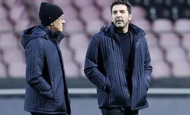 Italy's Gianluigi Buffon, right, walks on the pitch ahead of Tuesday's World Cup playoff final soccer match against Bosnia, at the Bilino Polje stadium, in Zenica, Bosnia, Monday, March 30, 2026. (AP Photo/Armin Durgut)