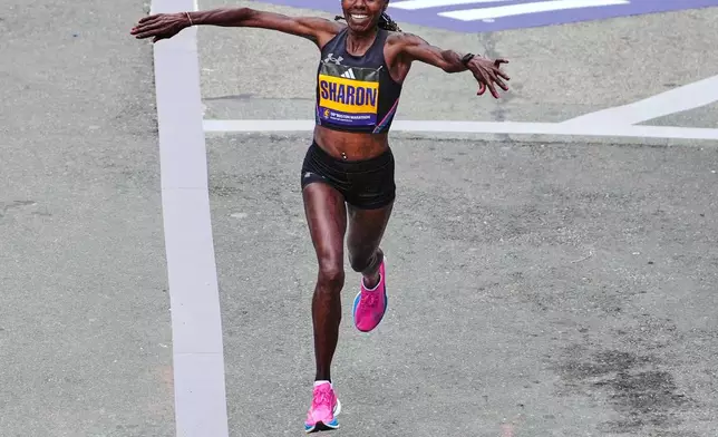Sharon Lokedi of Kenya, celebrates while approaching the finish line to win the women's division of the Boston Marathon, Monday, April 20, 2026, in Boston. (AP Photo/Charles Krupa)