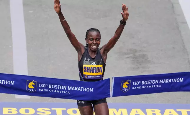 Sharon Lokedi of Kenya, celebrates after winning the women's division of the Boston Marathon, Monday, April 20, 2026, in Boston. (AP Photo/Charles Krupa)