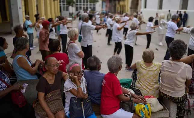 Elderly residents watch a tai chi class for seniors at the Belen Convent in Old Havana, Cuba, Thursday, Feb. 20, 2025. (AP Photo/Ramon Espinosa)