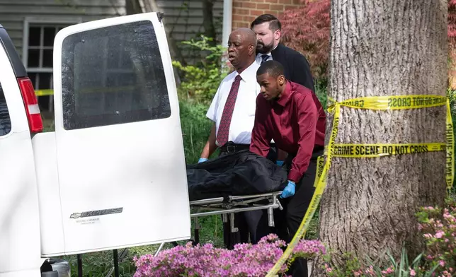 Fairfax County coroners remove a body from the home of former Virginia Lt. Gov. Justin Fairfax, in Annandale, Va., Thursday, April 16, 2026. (AP Photo/Cliff Owen)