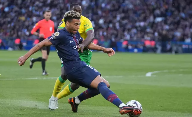 PSG's Desire Doue controls the ball during the French League One soccer match between Paris Saint-Germain and Nantes in Paris, France, Wednesday, April 22, 2026. (AP Photo/Michel Euler)