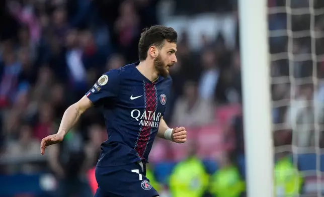 PSG's Khvicha Kvaratskhelia celebrates after scoring during the French League One soccer match between Paris Saint-Germain and Nantes in Paris, France, Wednesday, April 22, 2026. (AP Photo/Michel Euler)