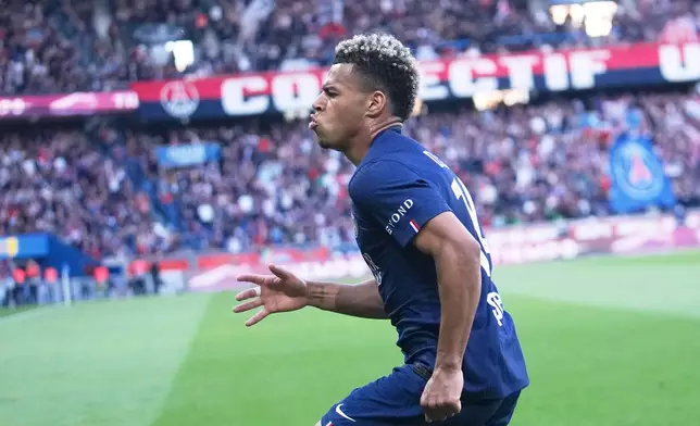 PSG's Desire Doue celebrates his goal during the French League One soccer match between Paris Saint-Germain and Nantes in Paris, France, Wednesday, April 22, 2026. (AP Photo/Michel Euler)