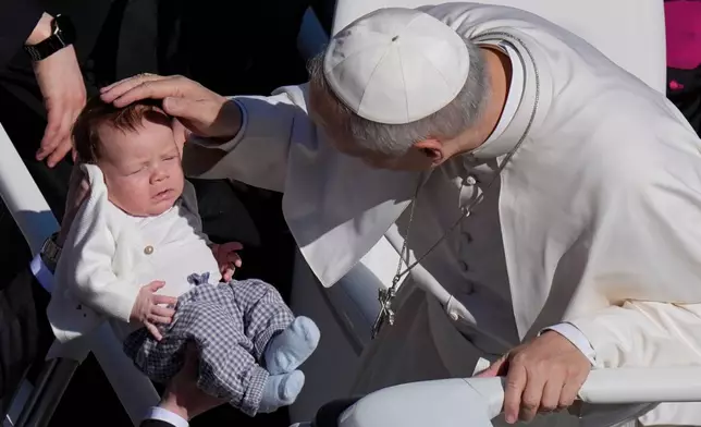 Pope Leo XIV greets the faithful at the end of Easter Mass he presided over in St. Peter's Square at the Vatican, Sunday, April 5, 2026. (AP Photo/Alessandra Tarantino)