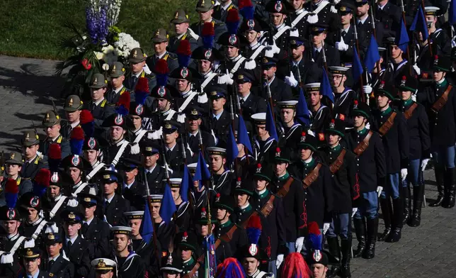 Italian military personnel in historical uniforms stand in St. Peter's Square at the Vatican prior to Easter Mass presided over by Pope Leo XIV, Sunday, April 5, 2026 (AP Photo/Alessandra Tarantino)
