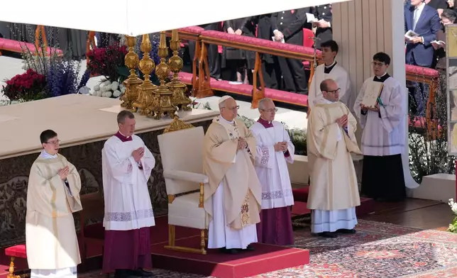 Pope Leo XIV presides over Easter Mass in St. Peter's Square at the Vatican, Sunday, April 5, 2026 (AP Photo/Alessandra Tarantino)