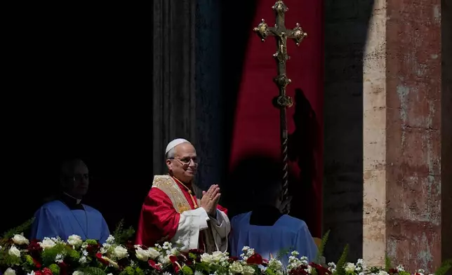Pope Leo XIV addresses the faithful after delivering the Urbi et Orbi blessing - Latin for "to the city of Rome and to the world" - from the central loggia of St. Peter's Basilica at the end of Easter Mass he presided over in St. Peter's Square at the Vatican, Sunday, April 5, 2026. (AP Photo/Alessandra Tarantino)