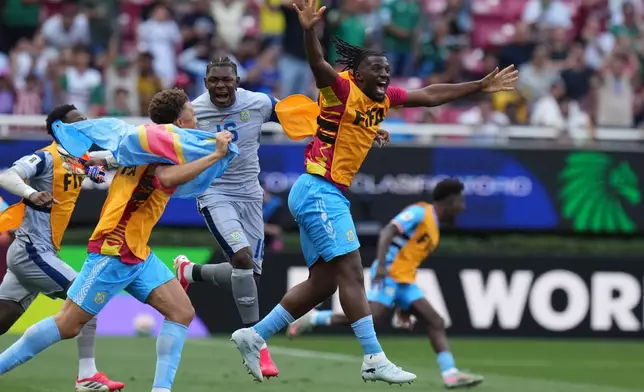DR Congo's players celebrate at the end of the World Cup playoff final soccer match between DR Congo and Jamaica in Guadalajara, Mexico, Tuesday, March 31, 2026. (AP Photo/Eduardo Verdugo)