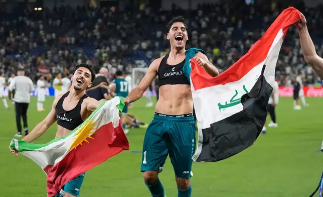 Iraq's players celebrate after the World Cup playoff final soccer match between Iraq and Bolivia in Monterrey, Mexico, Tuesday, March 31, 2026. (AP Photo/Fernando Llano)