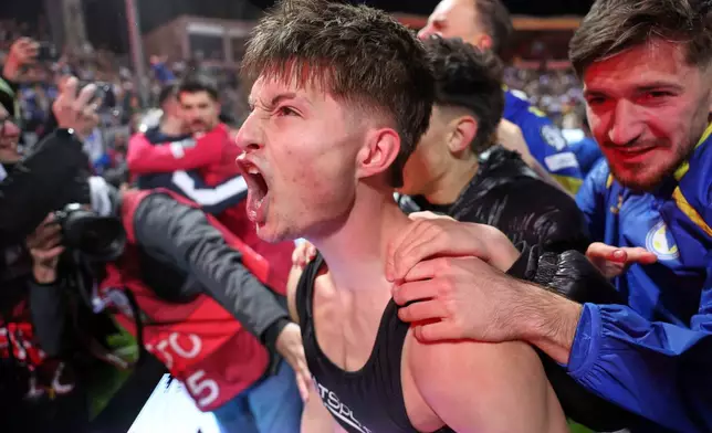 Bosnia's Esmir Bajraktarevic celebrates after winning a penalty shootout during the World Cup qualifying playoff final soccer match between Bosnia and Italy in Zenica, Bosnia, Tuesday, March 31, 2026. (AP Photo/Armin Durgut)