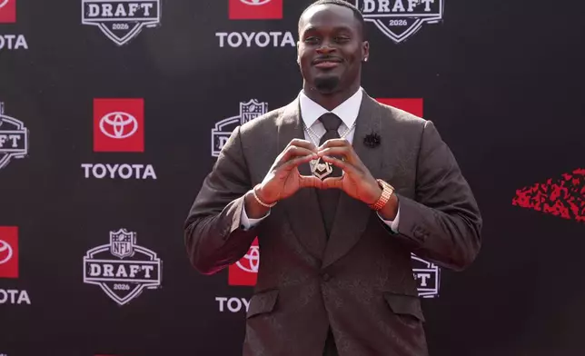 Notre Dame running back Jeremiyah Love poses on the red carpet before the first round of the NFL football draft, Thursday, April 23, 2026, in Pittsburgh. (AP Photo/Gene J. Puskar)