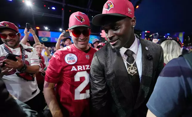 Notre Dame running back Jeremiyah Love meets with fans after being chosen by the Arizona Cardinals with the third overall pick during the first round of the NFL football draft, Thursday, April 23, 2026, in Pittsburgh. (AP Photo/Sue Ogrocki)