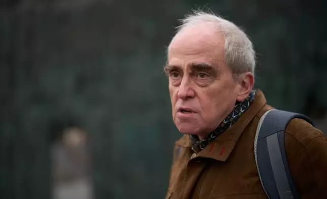 Jan Raczynski, chair of the International Memorial entity that was liquidated in Russia in 2021, speaks during his interview with the Associated Press in front of the Wall of Grief memorial to the victims of Soviet repressions in Moscow, Wednesday, April 8, 2026. (AP Photo/Alexander Zemlianichenko)