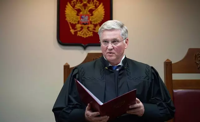 Court judge Vyacheslav Kirillov reads a ruling to outlaw the "international movement" Memorial as extremist in a move against Nobel Peace Prize-winning rights group in Moscow, Russia, Thursday, April 9, 2026. (AP Photo/Alexander Zemlianichenko)