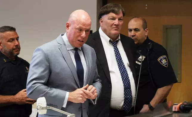 Attorney Michael Brown speaks with the judge as Rex A. Heuermann, pleads guilty to murdering seven women and admitted he killed an eighth in a string of long-unsolved crimes known as the Gilgo Beach killings, at a court hearing in Suffolk County Court in Riverhead, N.Y., Wednesday, April 8, 2026. (James Carbone/Newsday via AP, Pool)