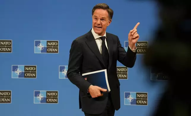 NATO Secretary General Mark Rutte leaves the podium after the launch of the NATO Secretary General's Annual Report for 2025 at NATO headquarters in Brussels, Thursday, March 26, 2026. (AP Photo/Virginia Mayo)