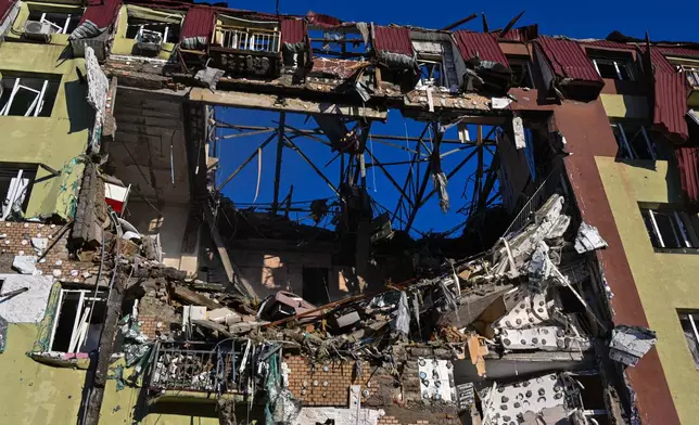 A residential building is seen heavily damaged after a Russian strike in Odesa, Ukraine, Monday, April 6, 2026. (AP Photo/Michael Shtekel)