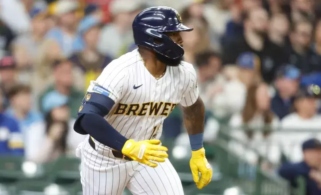 Milwaukee Brewers' Luis Rengifo (13) hits a two run double in the fourth inning of a baseball game against the Pittsburgh Pirates Sunday, April 26, 2026, in Milwaukee. (AP Photo/Jeffrey Phelps)