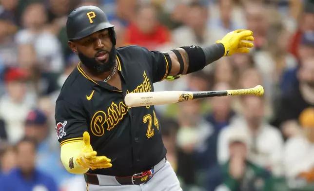 Pittsburgh Pirates designated hitter Marcell Ozuna loses his bat after fouling off a pitch during the fourth inning of a baseball game against the Milwaukee Brewers, Sunday, April 26, 2026, in Milwaukee. (AP Photo/Jeffrey Phelps)