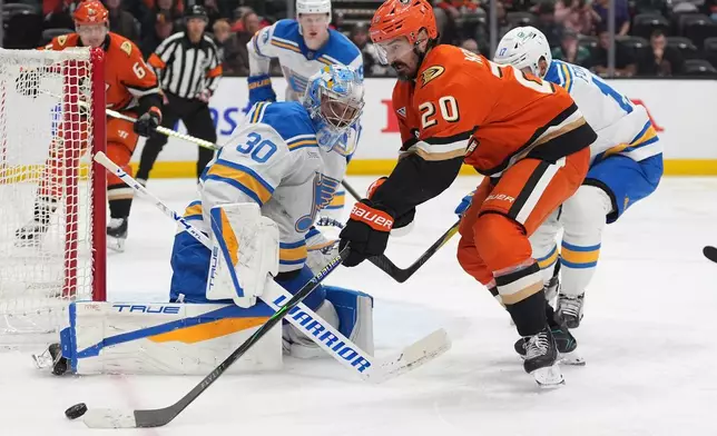 St. Louis Blues goaltender Joel Hofer (30) blocks a shot from Anaheim Ducks left wing Chris Kreider (20) during the third period of an NHL hockey game Friday, April 3, 2026, in Anaheim, Calif. (AP Photo/Gregory Bull)
